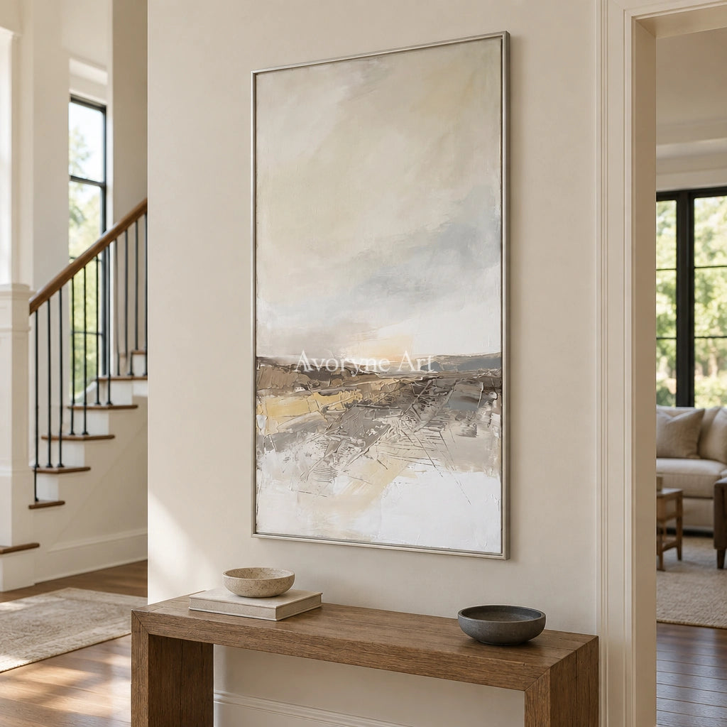 Bright Reverberation earth tone landscape wall art with a silver frame in an entryway