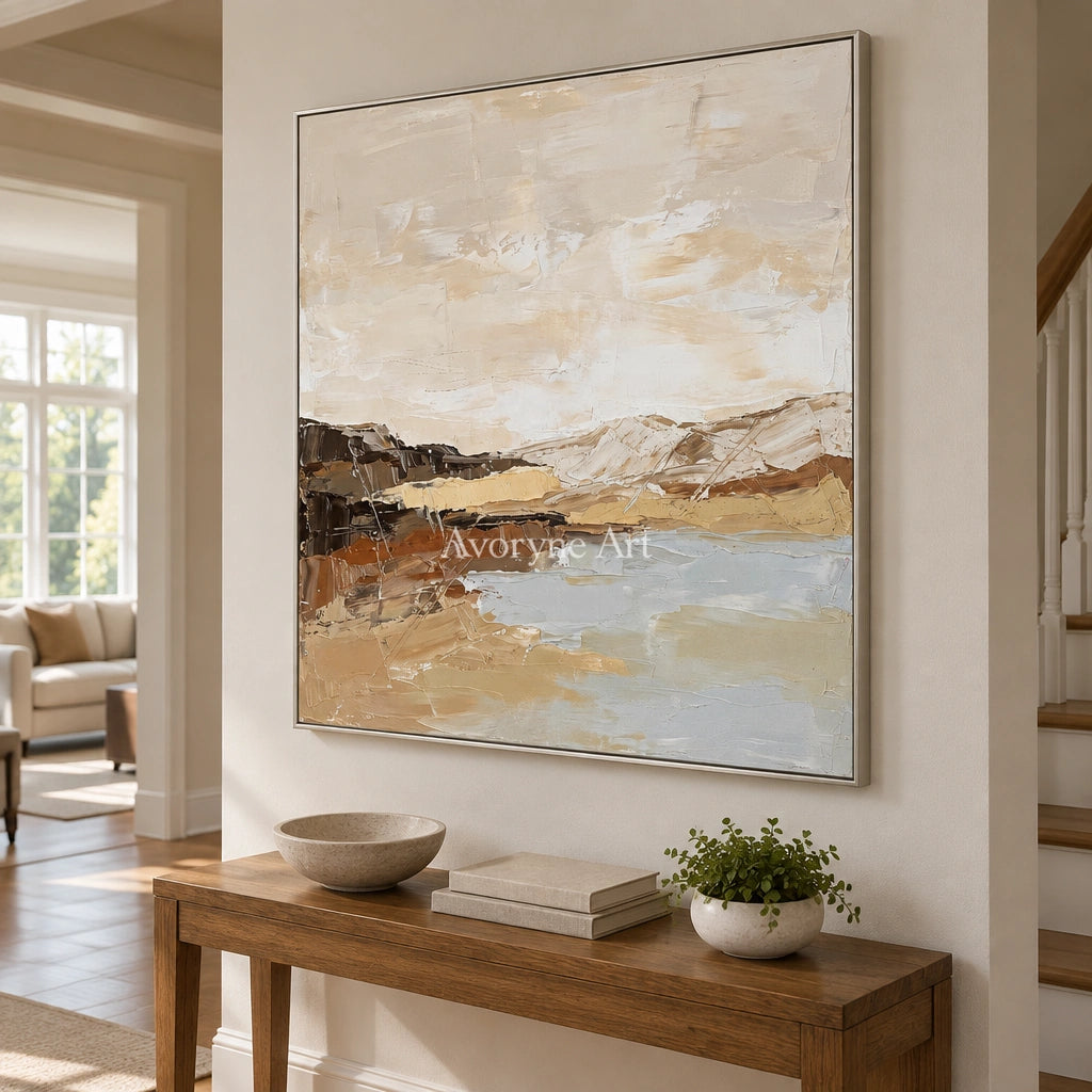 Bright Dialogue earth tone landscape wall art with a silver frame in an entryway