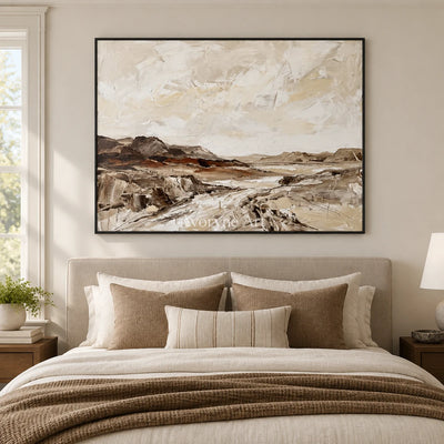 Winding Cadence earth tone landscape wall art with a black frame above a bed in a bedroom