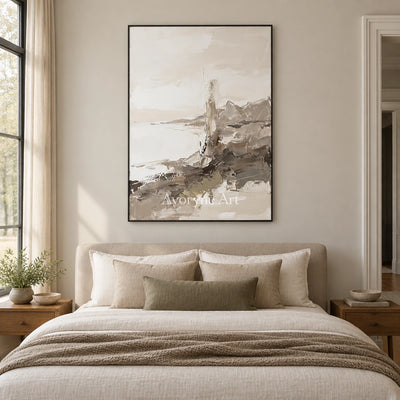 Winding Passage earth tone landscape wall art with a black frame above a bed in a bedroom