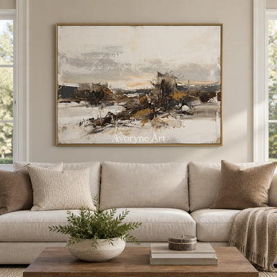 Winding Interval earth tone landscape wall art with a gold frame hanging in a living room