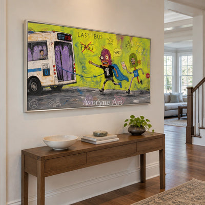 Warm Drift everyday character wall art with a silver frame in an entryway