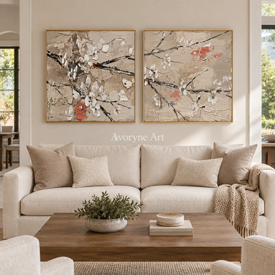 Quiet Horizon floral branch diptych with a gold frame hanging in a living room