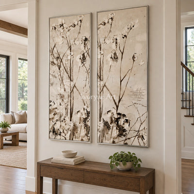 Quiet Drift floral branch diptych with a silver frame in an entryway