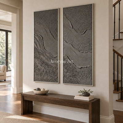 Quiet Prelude flowing relief diptych with a silver frame in an entryway