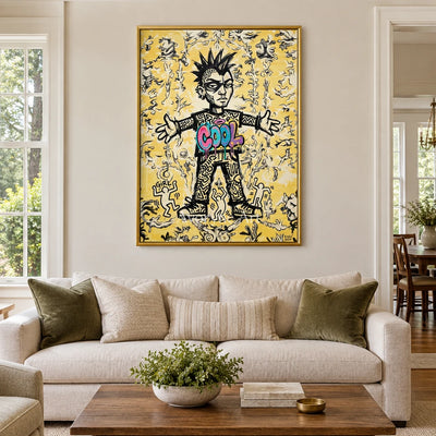 Hidden Reverie graffiti figure wall art with a gold frame hanging in a living room