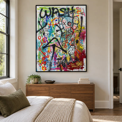 Hidden Echo graffiti figure wall art with a black frame above a bed in a bedroom