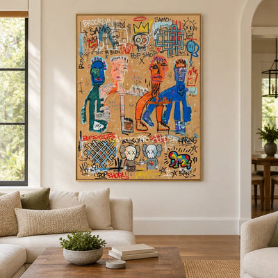Hidden Drift graffiti figure wall art with a gold frame hanging in a living room