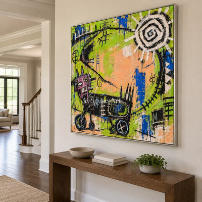 Hidden Dialogue graffiti figure wall art with a silver frame in an entryway
