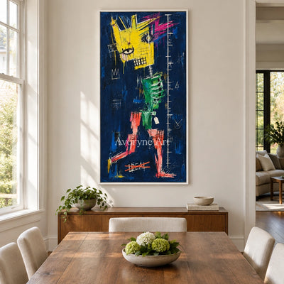 Open Gesture graffiti figure wall art with a white frame in a dining room