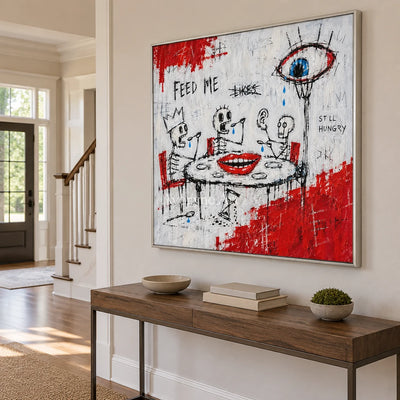 Open Story graffiti figure wall art with a silver frame in an entryway