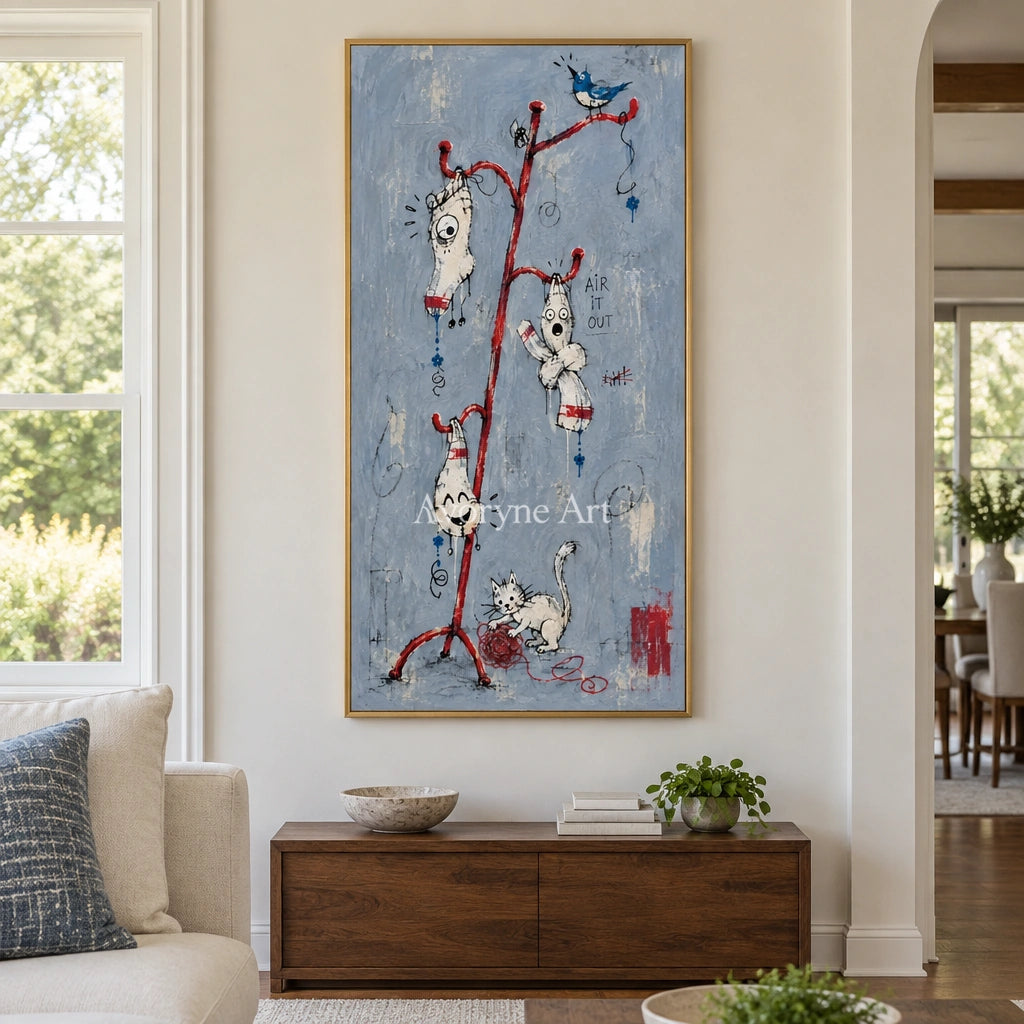 Open Current graffiti figure wall art with a gold frame hanging in a living room