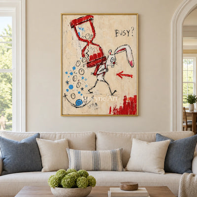Open Dialogue graffiti figure wall art with a gold frame hanging in a living room