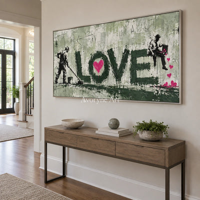 Distant Mosaic graffiti figure wall art with a silver frame in an entryway