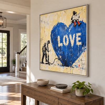 Distant Drift graffiti figure wall art with a silver frame in an entryway