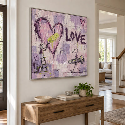Distant Current graffiti figure wall art with a silver frame in an entryway