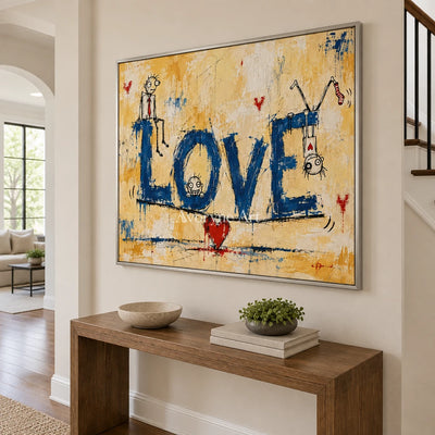 Distant Solace graffiti figure wall art with a silver frame in an entryway