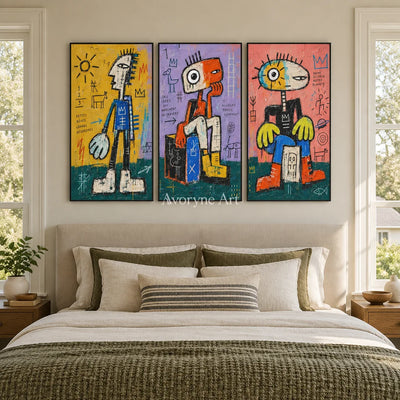 Soft Trace graffiti figure triptych with a black frame above a bed in a bedroom