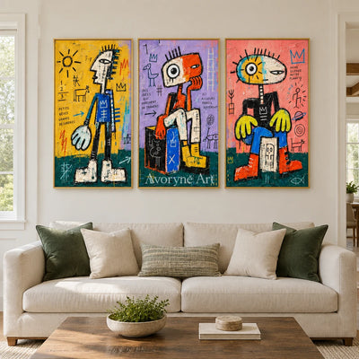 Soft Trace graffiti figure triptych with a gold frame hanging in a living room