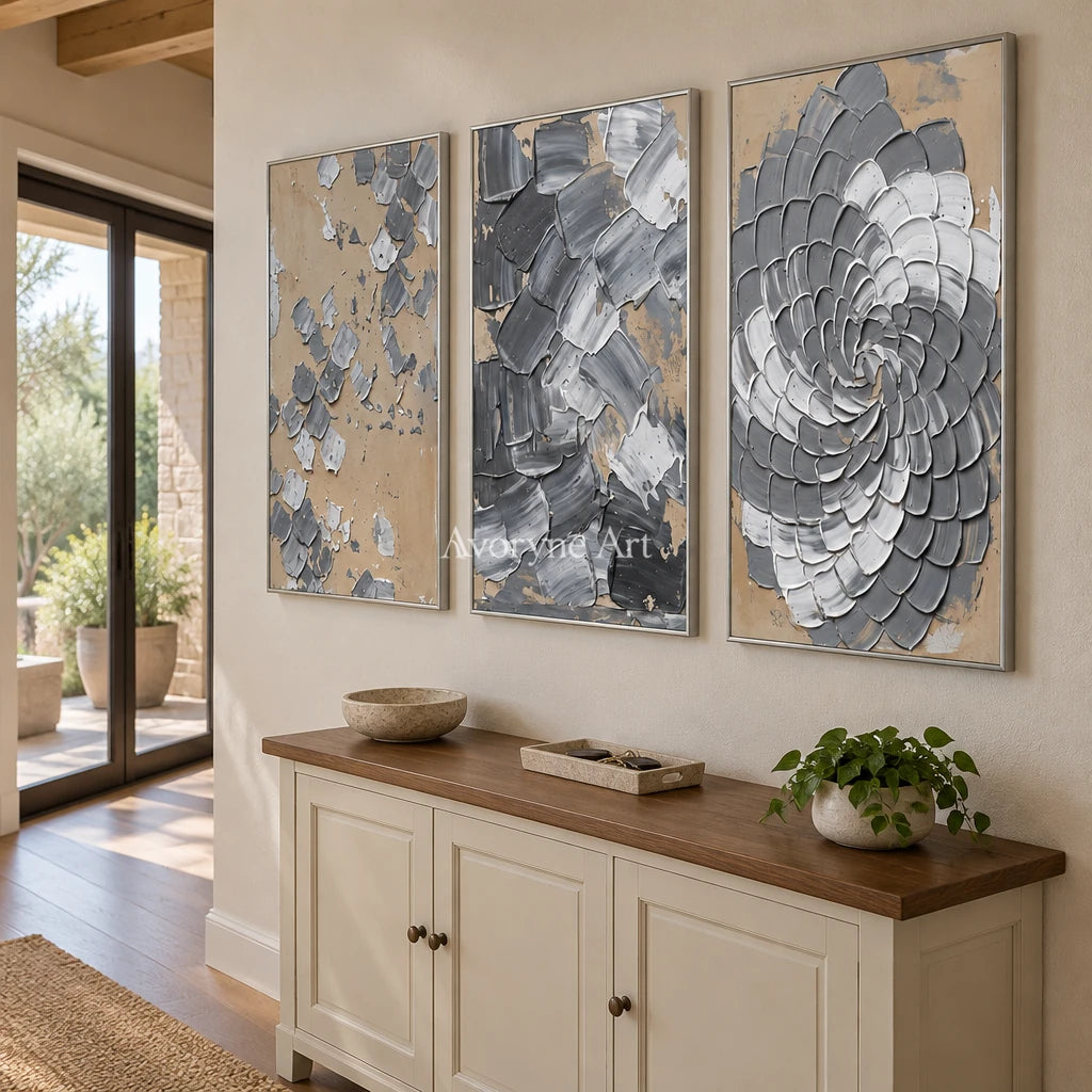 Mineral Trace gray curl relief triptych with a silver frame in an entryway
