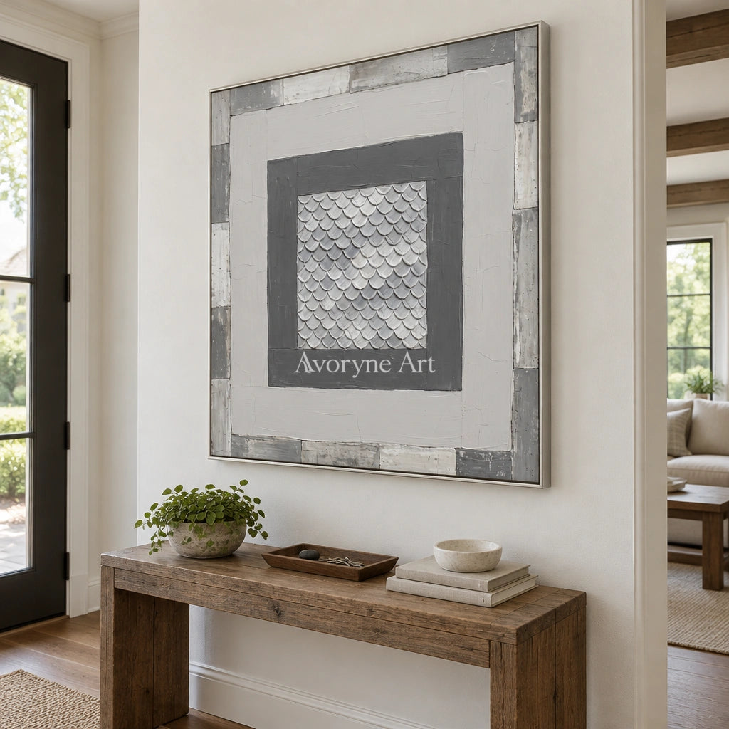 Hushed Echo gray scale relief wall art with a silver frame in an entryway