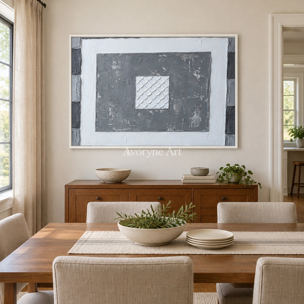 Hushed Mosaic gray scale relief wall art with a white frame in a dining room