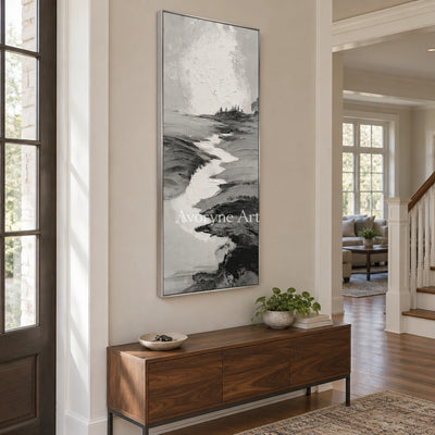 Pale Measure gray water landscape wall art with a silver frame in an entryway