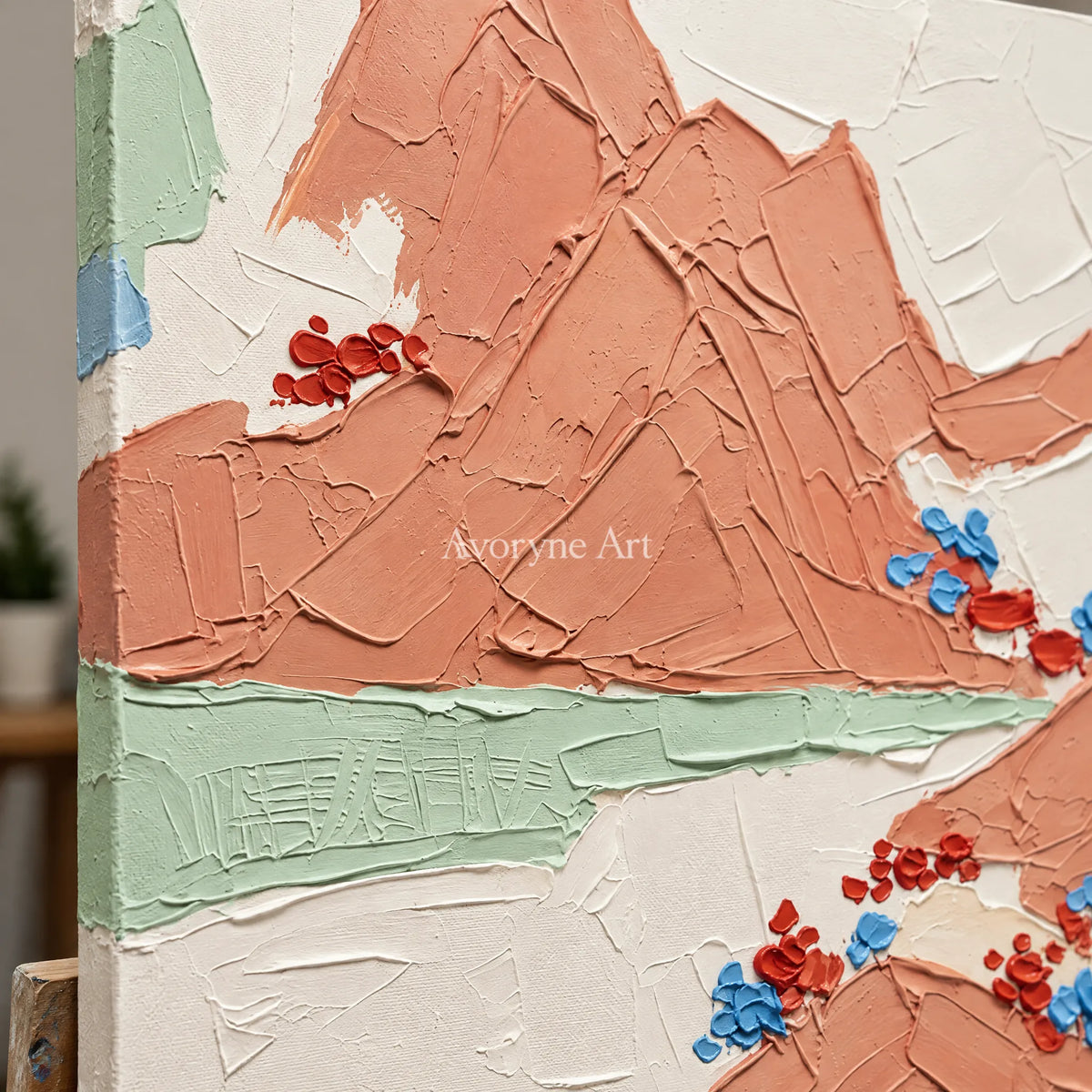 Close-up of the hand-painted texture of Restful Trace green mountain wall art on an easel
