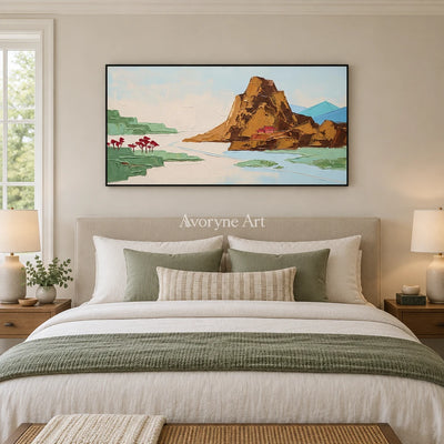 Restful Vista green mountain wall art with a black frame above a bed in a bedroom