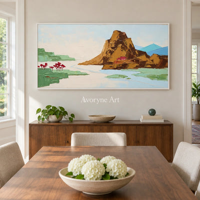 Restful Vista green mountain wall art with a white frame in a dining room