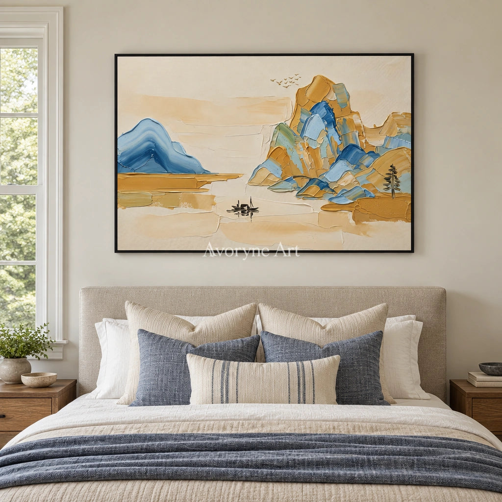 Faint Cadence green mountain wall art with a black frame above a bed in a bedroom