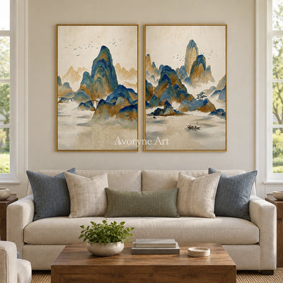 Faint Horizon green mountain diptych with a gold frame hanging in a living room