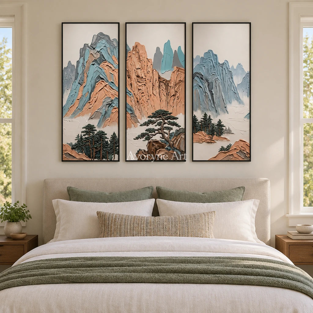 Faint Echo green mountain triptych with a black frame above a bed in a bedroom