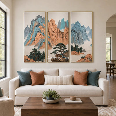 Faint Echo green mountain triptych with a gold frame hanging in a living room