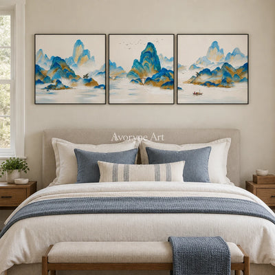 Faint Gesture green mountain triptych with a black frame above a bed in a bedroom