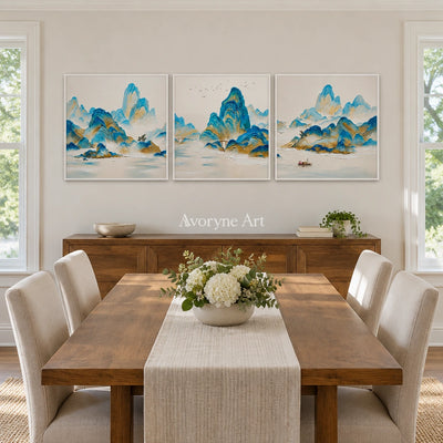 Faint Gesture green mountain triptych with a white frame in a dining room