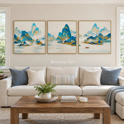 Faint Gesture green mountain triptych with a gold frame hanging in a living room