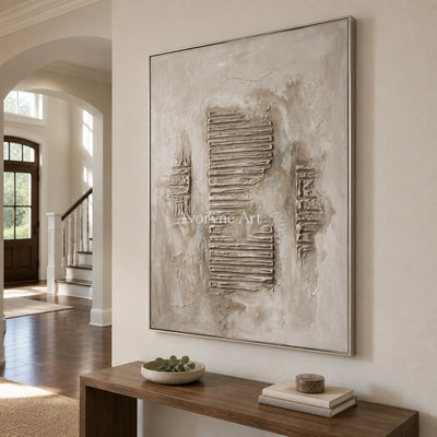 Amber Gesture grooved texture wall art with a silver frame in an entryway