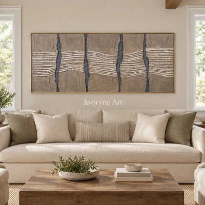 Amber Memory grooved texture wall art with a gold frame hanging in a living room