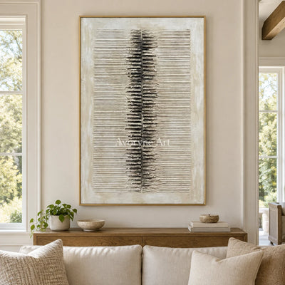 Amber Dialogue grooved texture wall art with a gold frame hanging in a living room