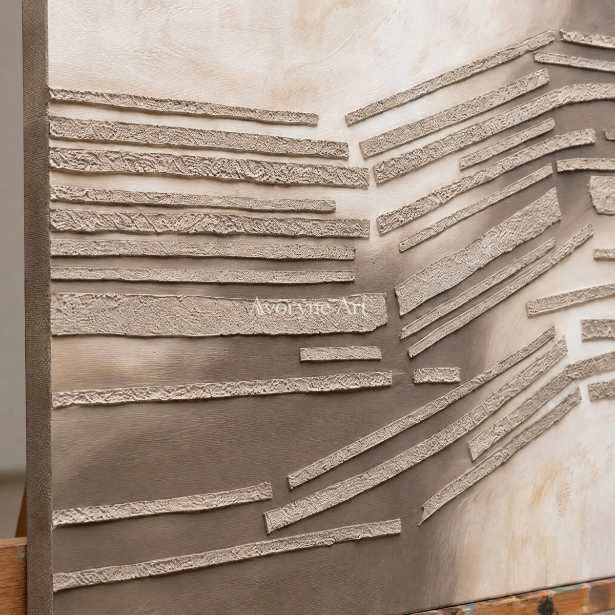 Close-up of the hand-painted texture of Soft Drift grooved texture wall art on an easel