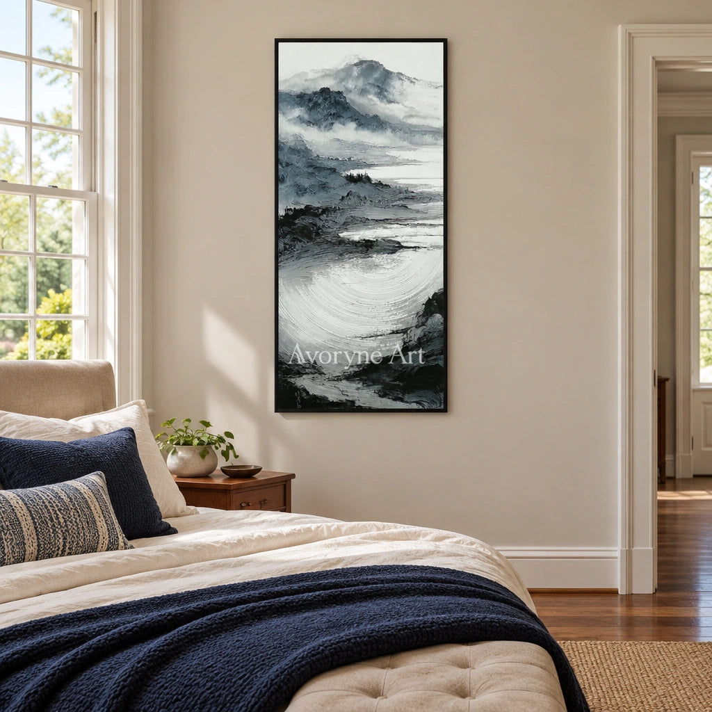 Pale Haven ink mountain water wall art with a black frame above a bed in a bedroom