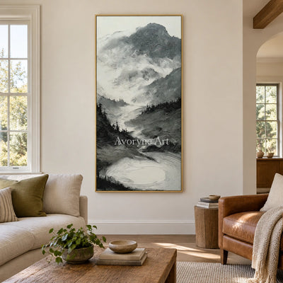 Pale Field ink mountain water wall art with a gold frame hanging in a living room