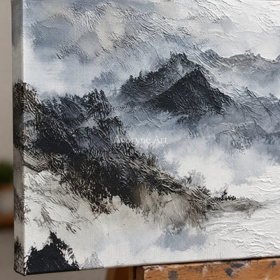 Close-up of the hand-painted texture of Pale Sonata ink mountain water wall art on an easel