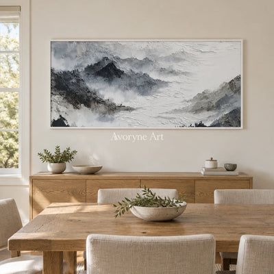 Pale Sonata ink mountain water wall art with a white frame in a dining room