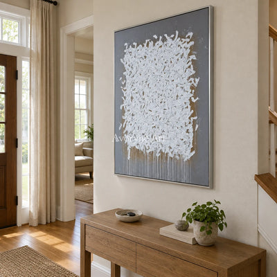 Lucent Field ivory curl relief wall art with a silver frame in an entryway