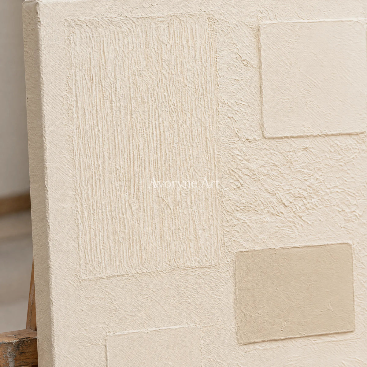 Close-up of the hand-painted texture of Woven Gesture ivory geometric art on an easel