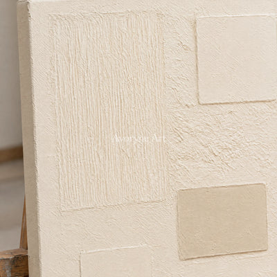 Close-up of the hand-painted texture of Woven Gesture ivory geometric art on an easel