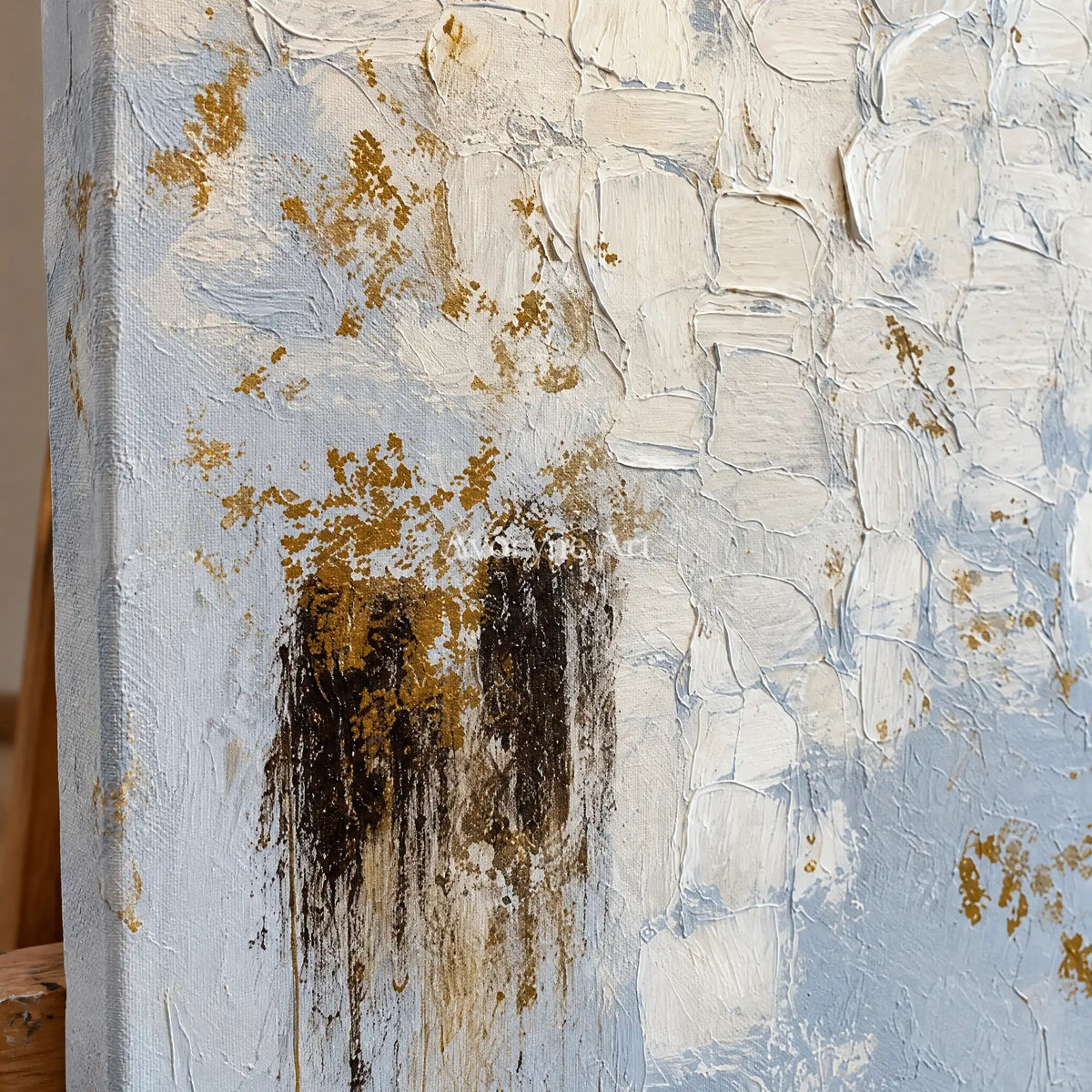 Close-up of the hand-painted texture of Gentle Haven ivory gold relief wall art on an easel