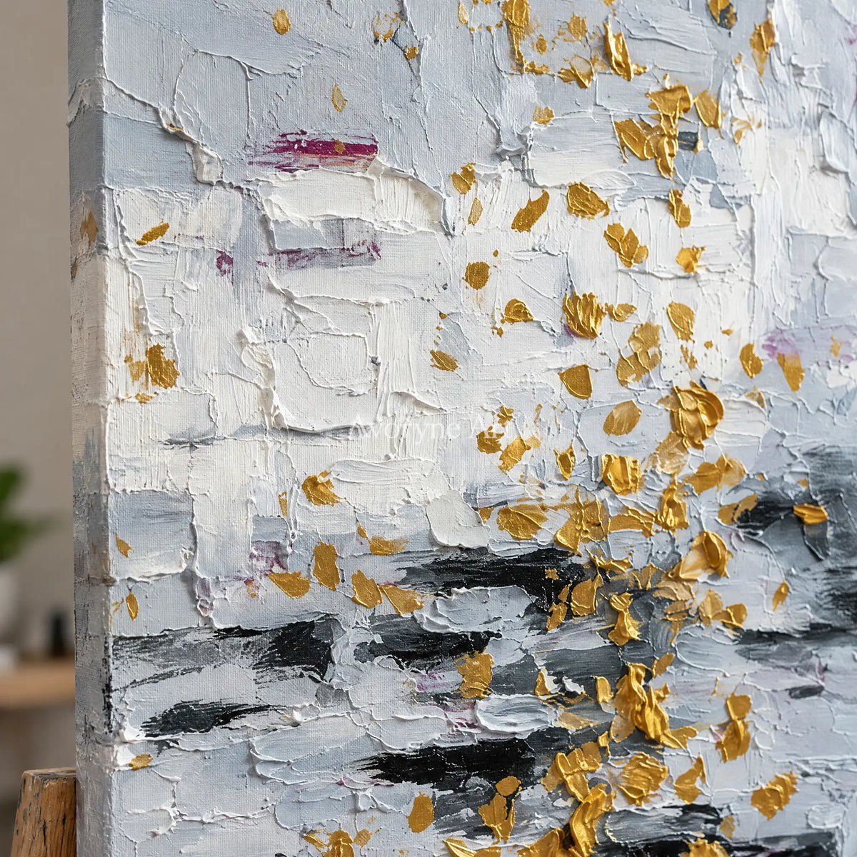 Close-up of the hand-painted texture of Gentle Measure ivory gold relief wall art on an easel